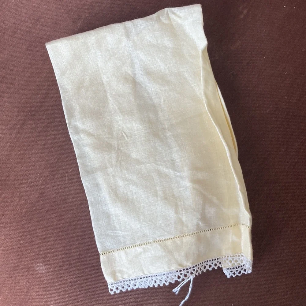 One fine linen embroidered tea towel. A muted butter yellow Vintage 1960s